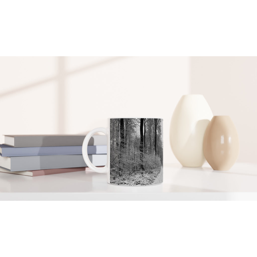 Winter forest mug: Minimalist black and white winter forest photography with bare trees and snow, printed on a high-quality white ceramic mug for a peaceful morning routine.